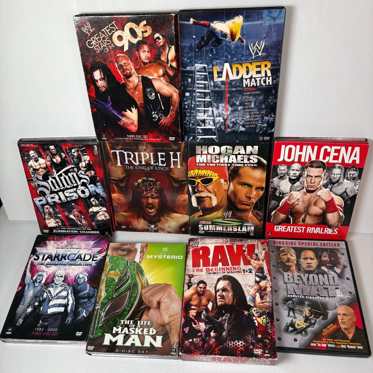 Lot of 10 WWE Anthologies and Pay-Per-View DVD Sets Starrcade, Summerslam & More