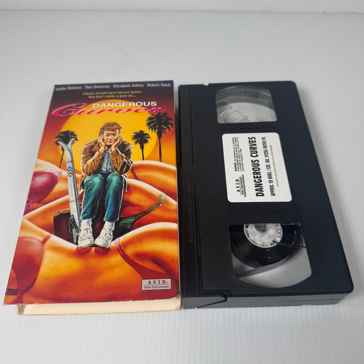 Dangerous Curves VHS 1988 Comedy Original Release Tate Donovan Leslie Nielsen