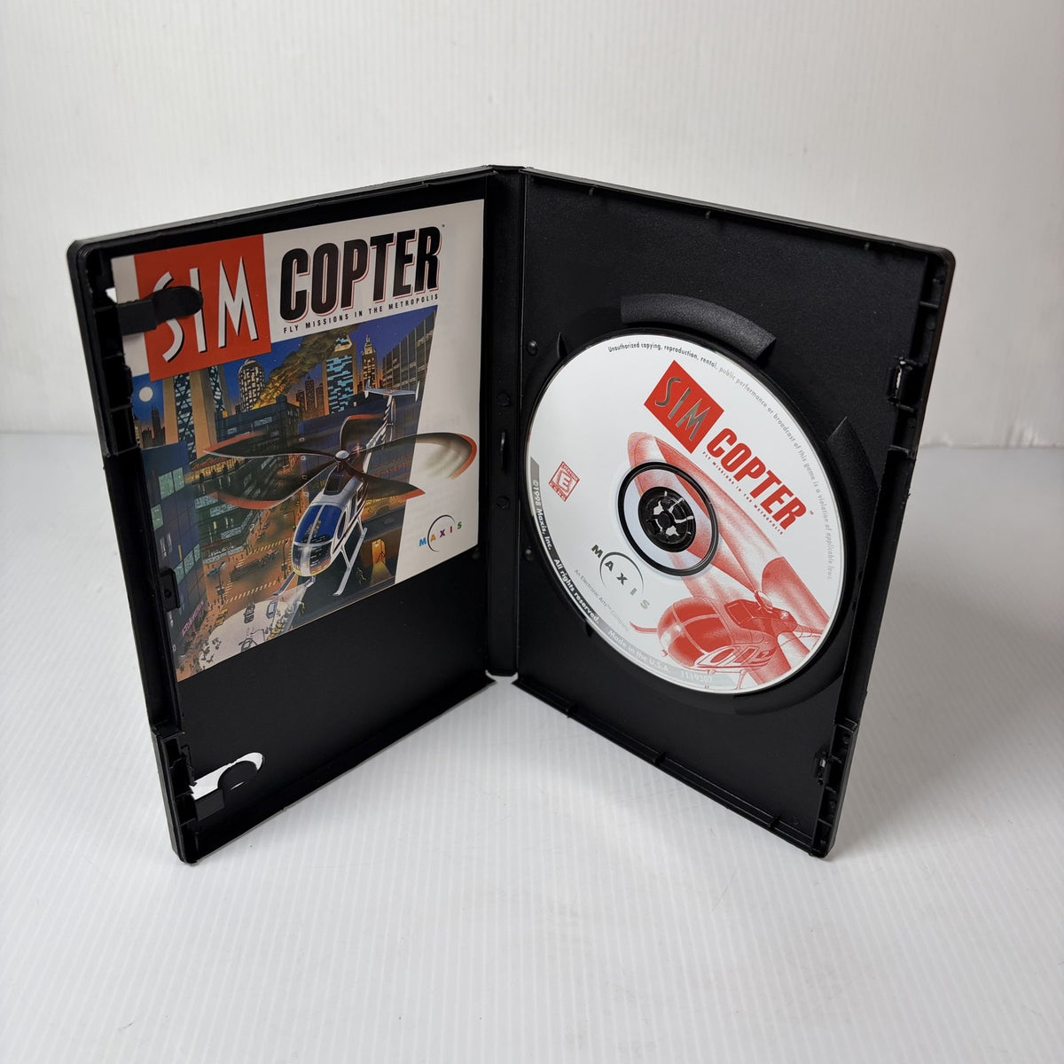 Sim Copter PC CD-ROM Game Disc and Manual Maxis Fly Missions in the Metropolis