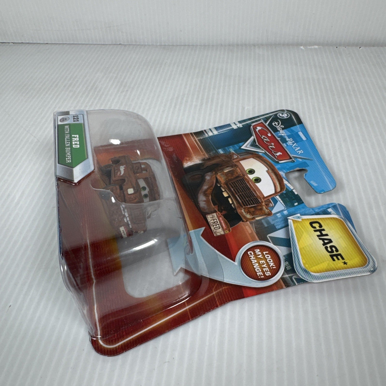 Mattel Disney Pixar Cars Lenticular Eyes Fred with Fallen Bumper No. 121 Chase