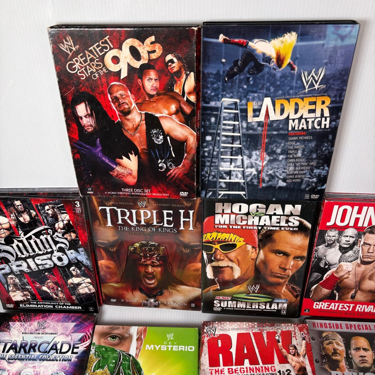 Lot of 10 WWE Anthologies and Pay-Per-View DVD Sets Starrcade, Summerslam & More