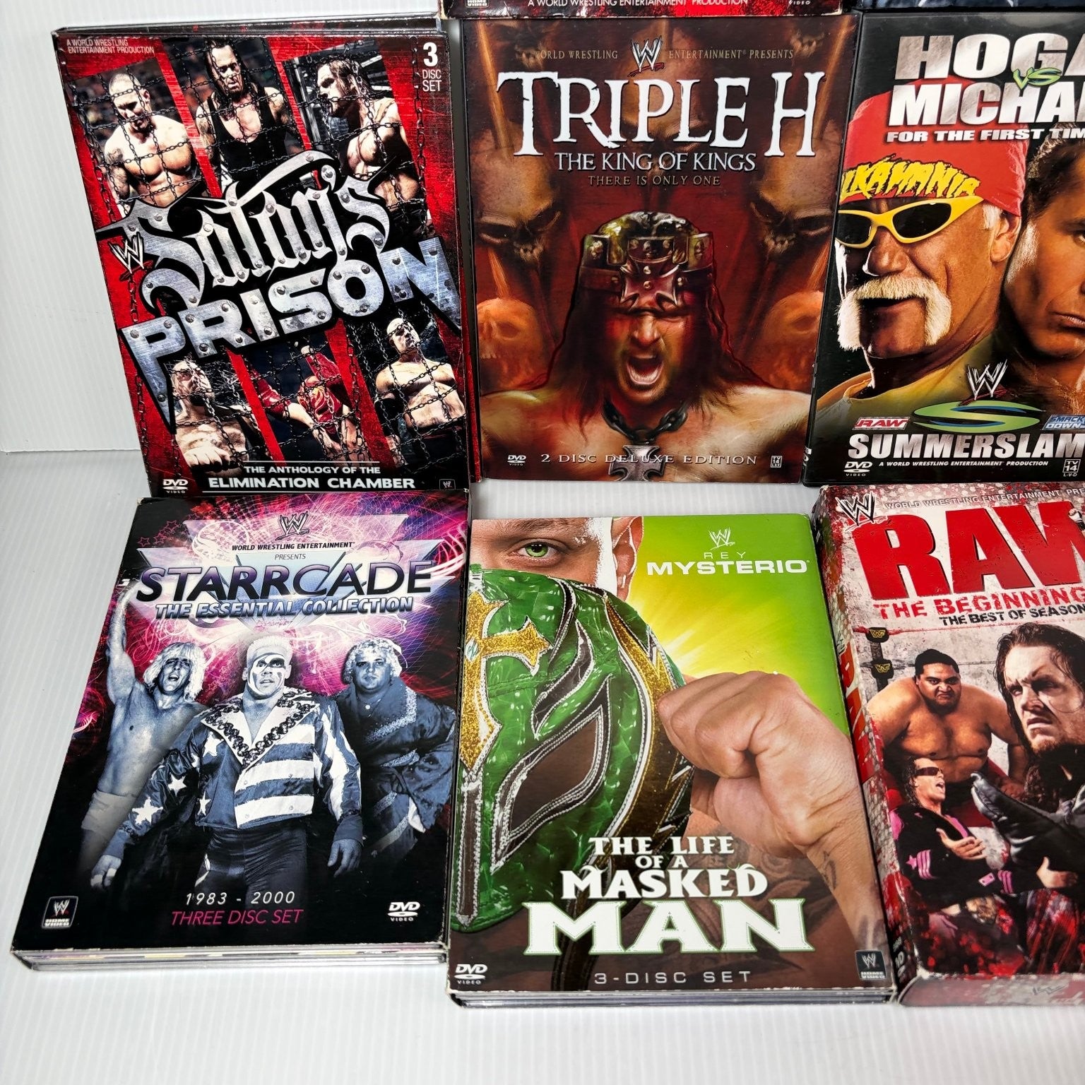 Lot of 10 WWE Anthologies and Pay-Per-View DVD Sets Starrcade, Summerslam & More