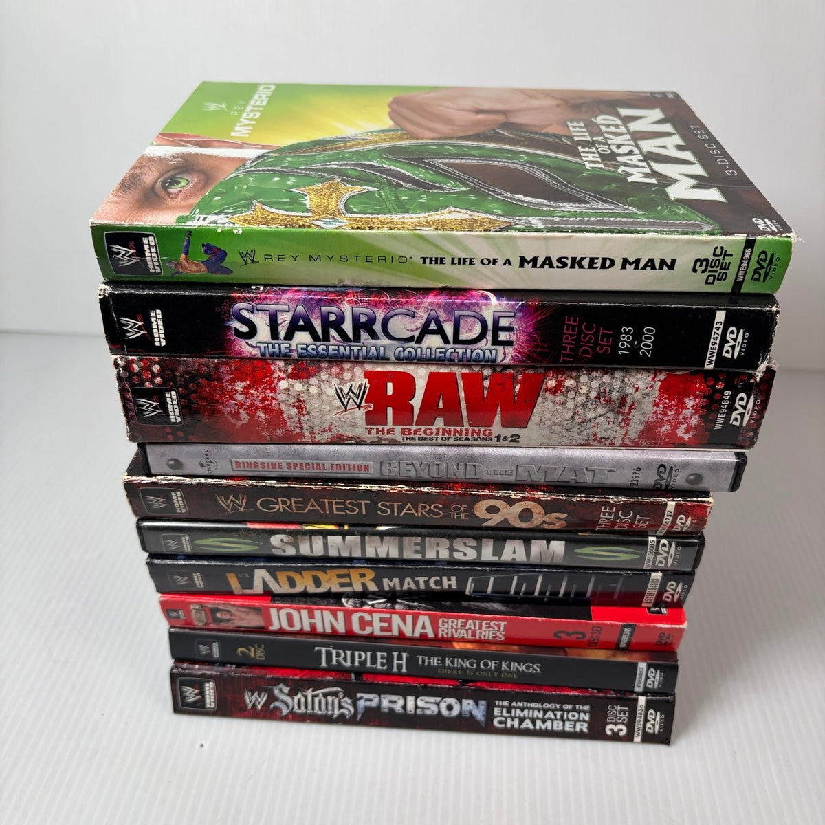 Lot of 10 WWE Anthologies and Pay-Per-View DVD Sets Starrcade, Summerslam & More