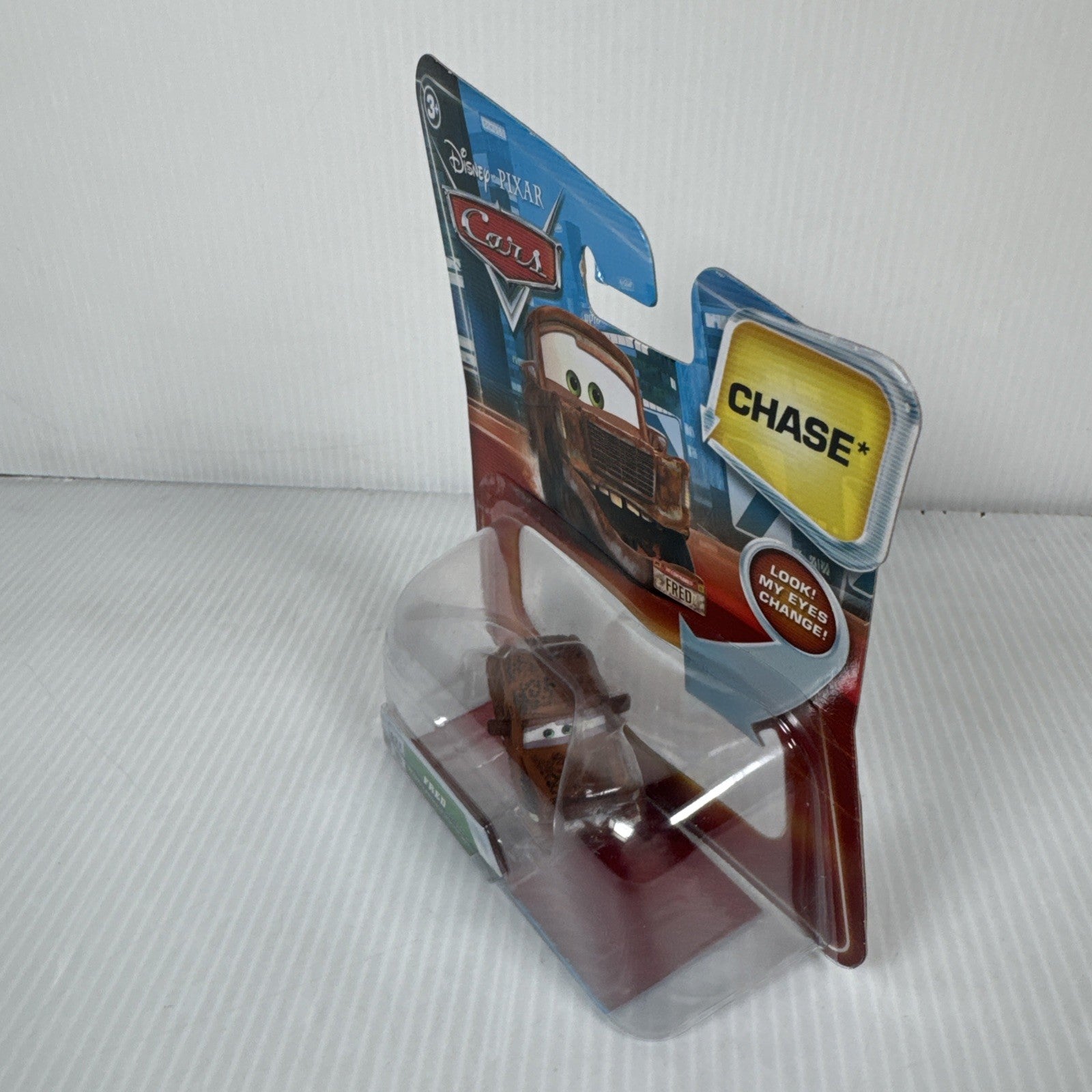 Mattel Disney Pixar Cars Lenticular Eyes Fred with Fallen Bumper No. 121 Chase