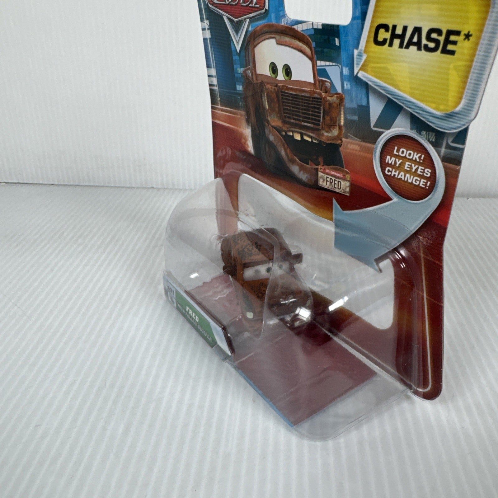 Mattel Disney Pixar Cars Lenticular Eyes Fred with Fallen Bumper No. 121 Chase