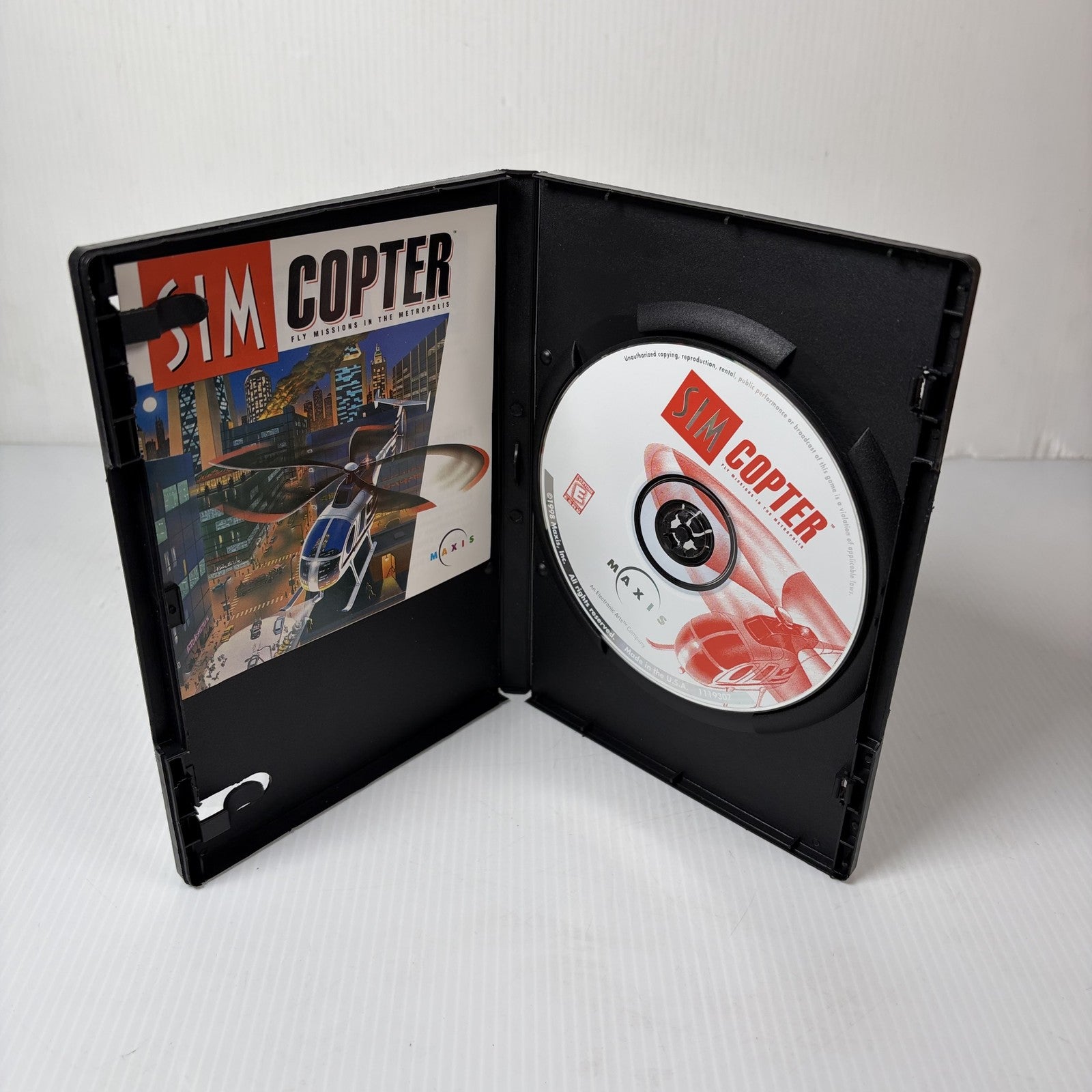 Sim Copter PC CD-ROM Game Disc and Manual Maxis Fly Missions in the Metropolis